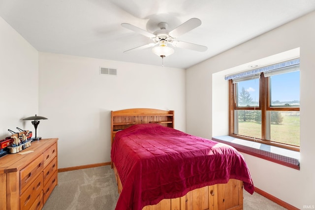 carpeted bedroom with ceiling fan