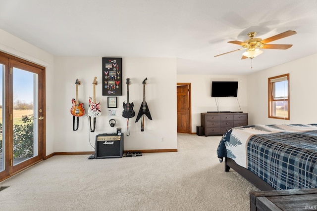 carpeted bedroom with ceiling fan, multiple windows, and access to exterior