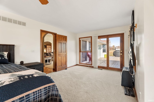 carpeted bedroom with access to outside and ceiling fan