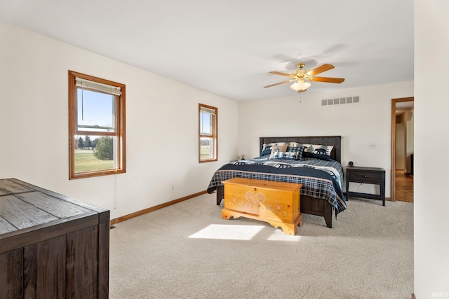 bedroom featuring ceiling fan and light colored carpet