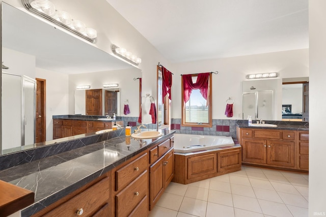 bathroom featuring vanity, shower with separate bathtub, and tile patterned floors