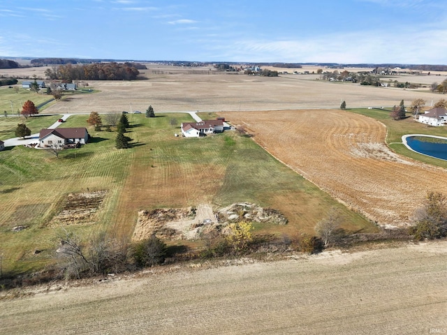 birds eye view of property featuring a rural view