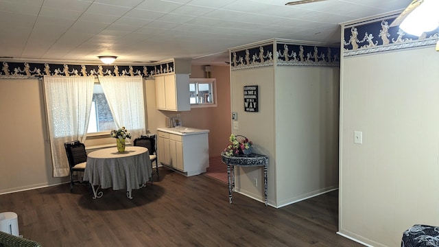 dining area with dark hardwood / wood-style floors