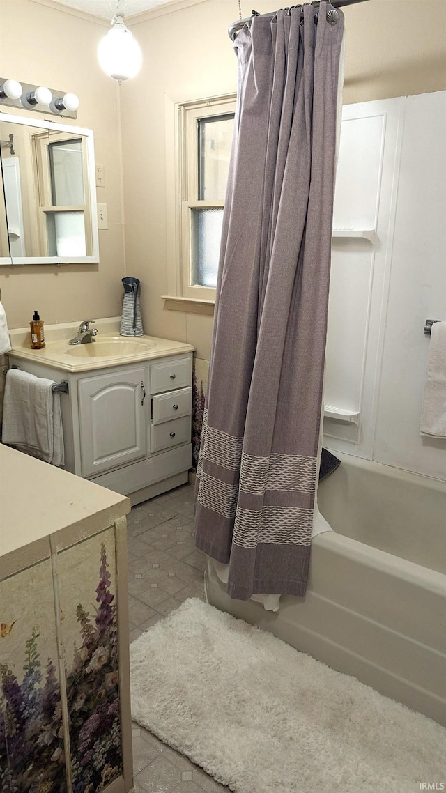 bathroom with vanity and shower / bathtub combination with curtain