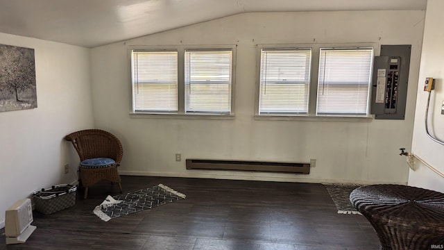 sitting room with electric panel, lofted ceiling, and a baseboard radiator