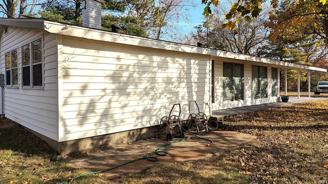 1911 Kroemer Rd, Fort Wayne, IN 46808 - view of home's exterior with a chimney