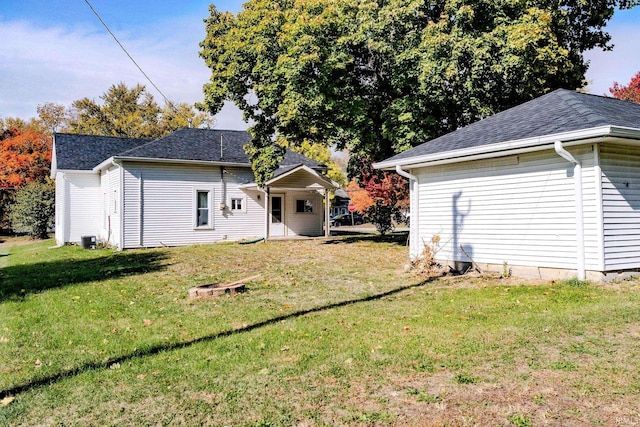 exterior space featuring a lawn and cooling unit