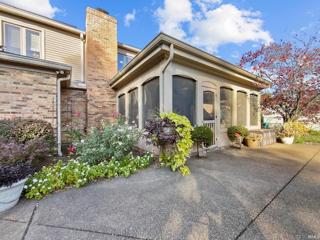 view of side of home featuring a patio