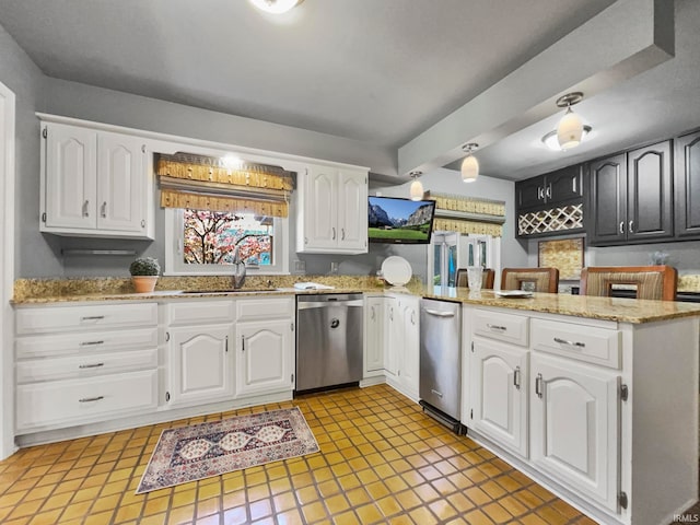 kitchen featuring stainless steel dishwasher, sink, white cabinets, and kitchen peninsula