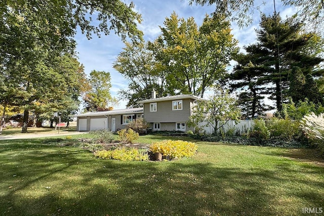 view of front facade with a front yard and a garage