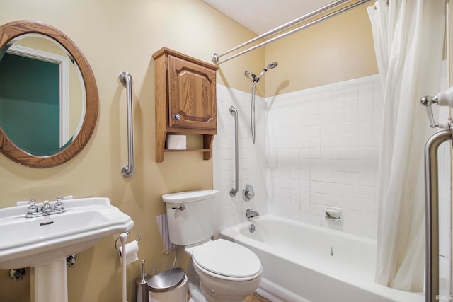 bathroom with shower / tub combo and toilet