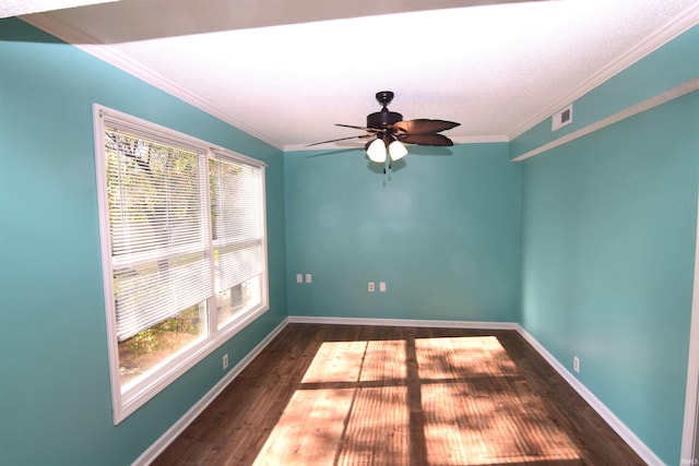 unfurnished room featuring ornamental molding, dark hardwood / wood-style floors, and ceiling fan