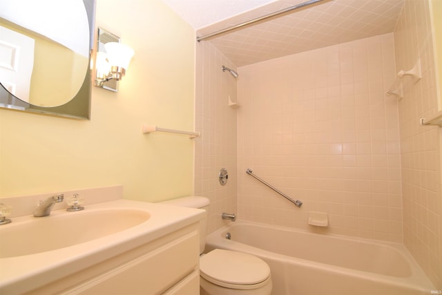 full bathroom featuring vanity, toilet, and tiled shower / bath