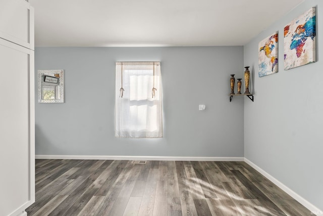 empty room featuring dark hardwood / wood-style floors