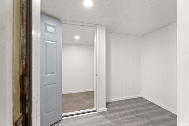 interior space featuring hardwood / wood-style floors and a paneled ceiling