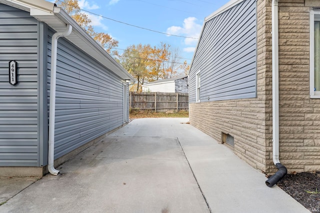 view of property exterior with a patio