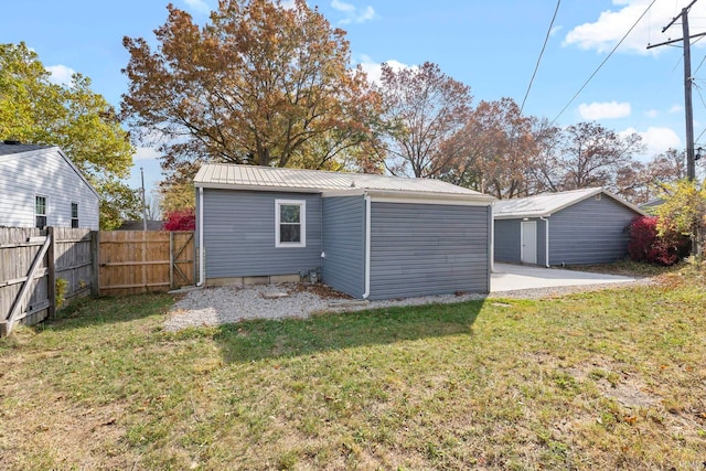 rear view of house with a lawn