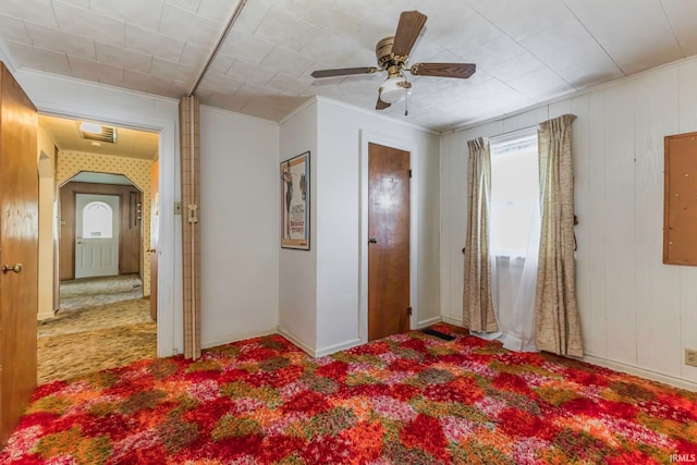 bedroom with ornamental molding, carpet flooring, and ceiling fan