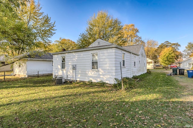 view of home's exterior featuring a yard and cooling unit