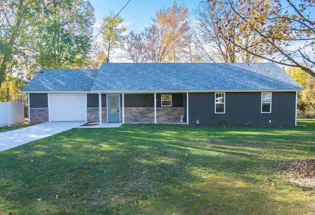 ranch-style home with a front yard and a garage