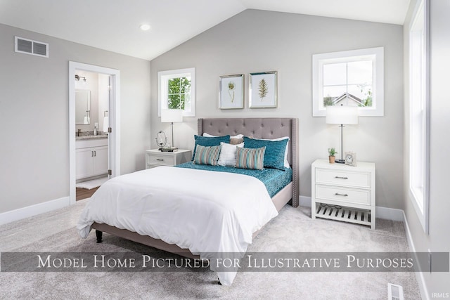 carpeted bedroom featuring connected bathroom and lofted ceiling