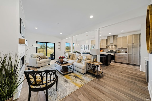 living room with a chandelier and hardwood / wood-style floors