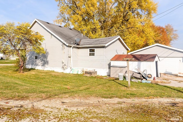 back of property with a lawn