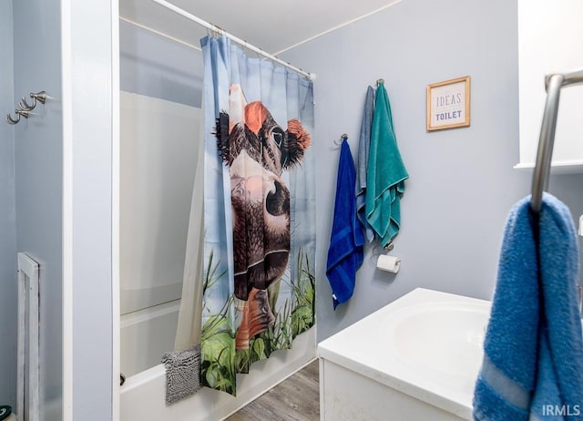 bathroom featuring vanity, shower / tub combo with curtain, and hardwood / wood-style floors