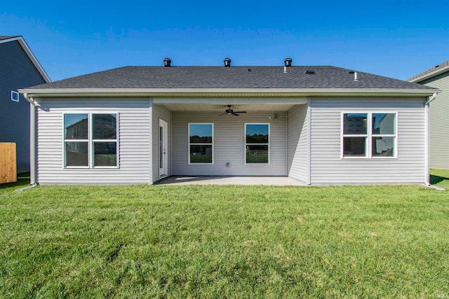 rear view of house with a yard, a patio, and ceiling fan