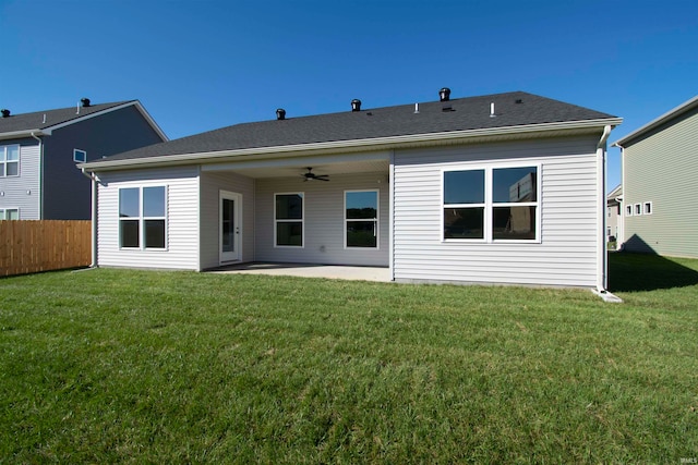 rear view of property with a patio, a lawn, and ceiling fan