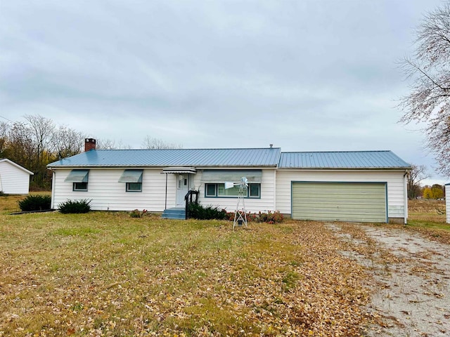 view of front of house with a front lawn and a garage