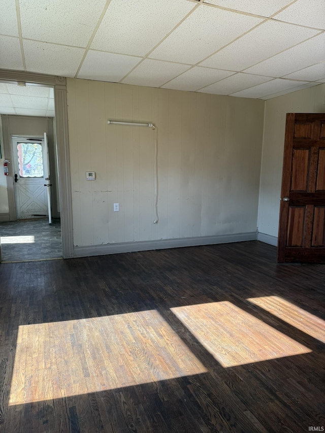 422 E Water St A-B, Unit A-B Portland, IN 47371 - unfurnished room with a drop ceiling, baseboards, and wood finished floors