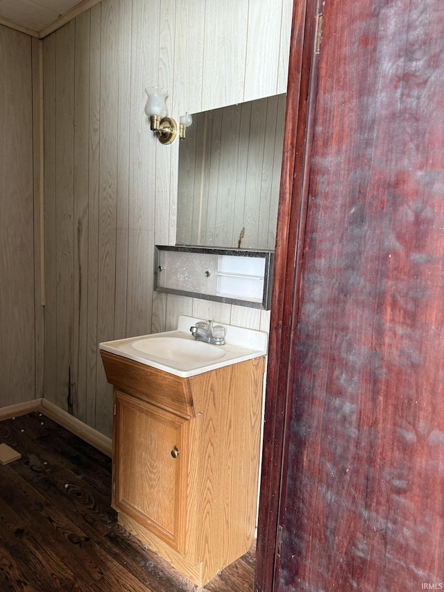 422 E Water St A-B, Unit A-B Portland, IN 47371 - half bathroom featuring wood finished floors, vanity, wooden walls, and baseboards