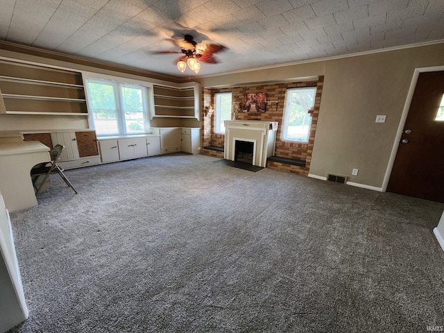 unfurnished living room featuring carpet floors, ceiling fan, and ornamental molding