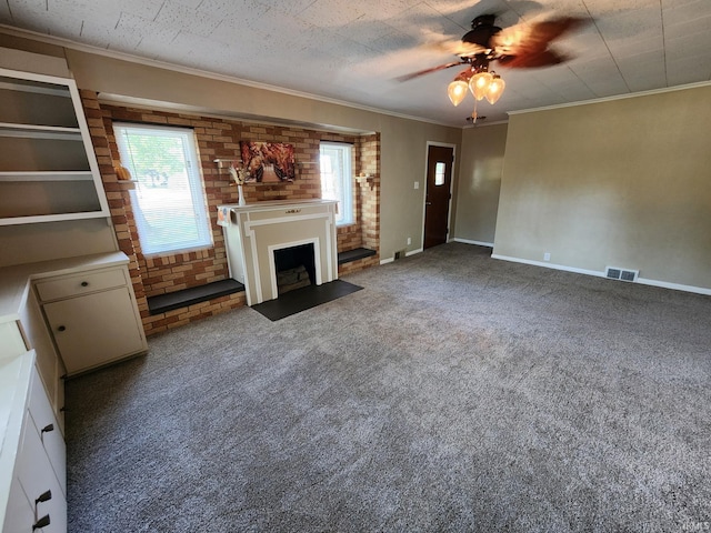 unfurnished living room featuring carpet, a textured ceiling, ceiling fan, and ornamental molding