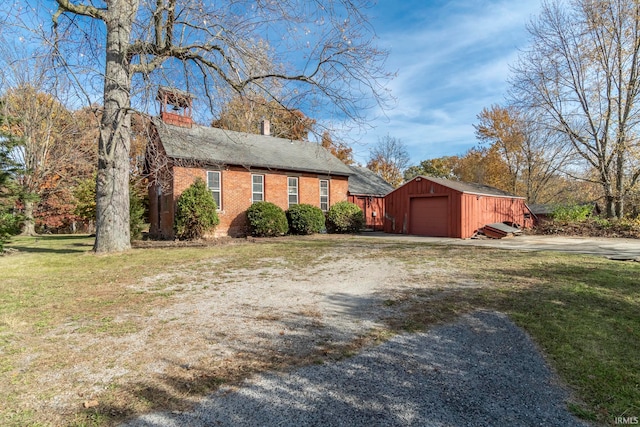 view of home's exterior with a yard and a garage