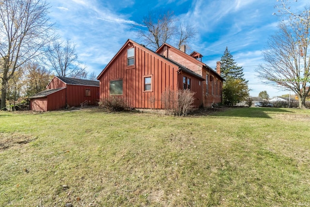 view of side of home featuring a lawn