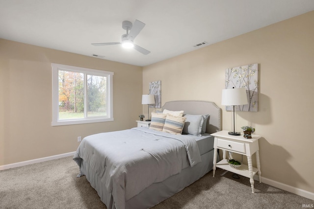 bedroom featuring light carpet and ceiling fan