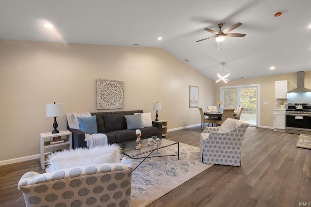 living room with lofted ceiling, hardwood / wood-style floors, and ceiling fan