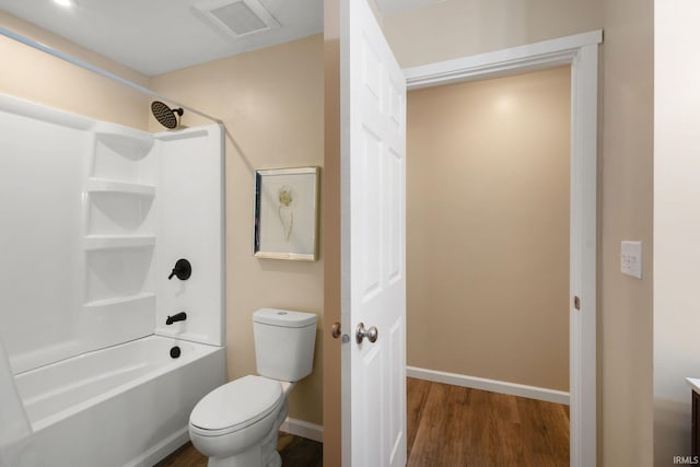 full bathroom featuring toilet, bathtub / shower combination, hardwood / wood-style floors, and vanity