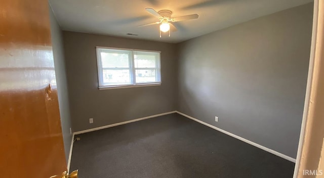 carpeted empty room with ceiling fan