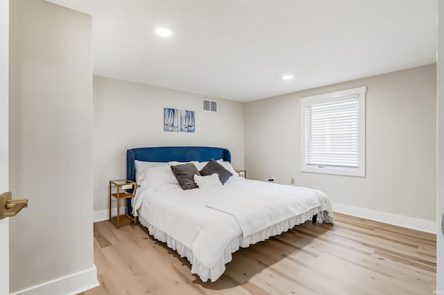 bedroom featuring light hardwood / wood-style floors