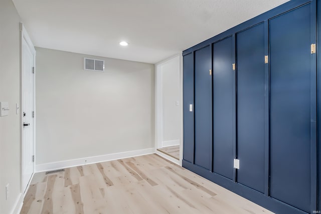 interior space featuring a closet and light hardwood / wood-style flooring