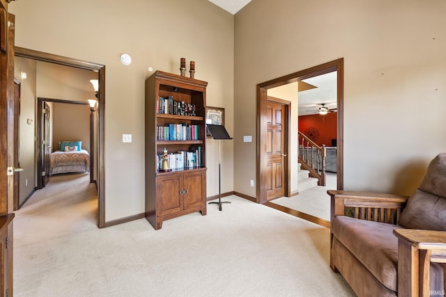 sitting room with light carpet and ceiling fan