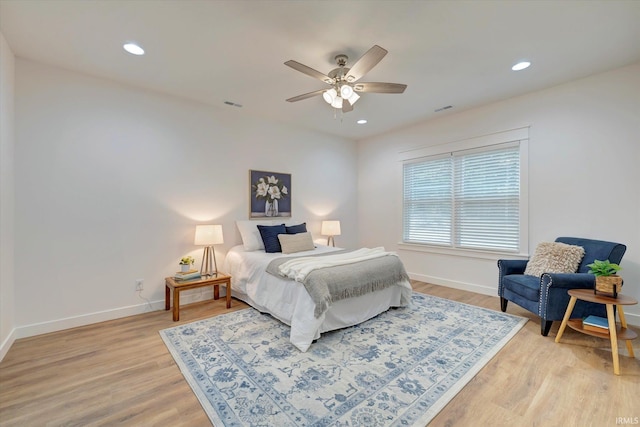 bedroom featuring light hardwood / wood-style floors and ceiling fan