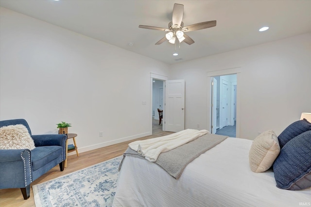 bedroom featuring light hardwood / wood-style flooring and ceiling fan