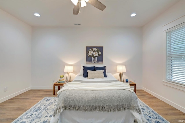 bedroom featuring ceiling fan and hardwood / wood-style flooring