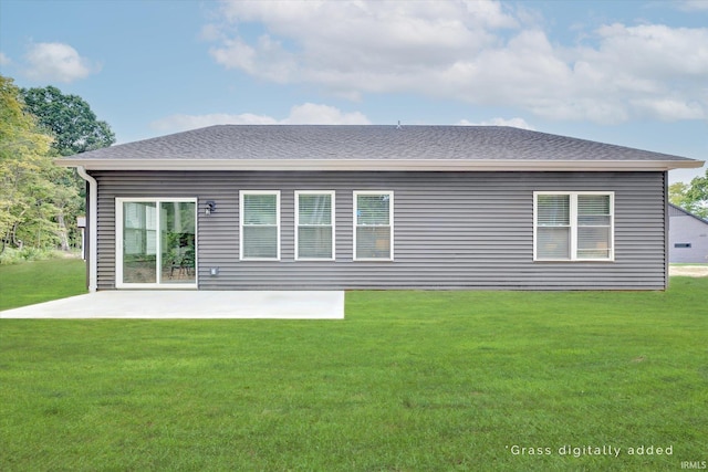 rear view of property featuring a yard and a patio