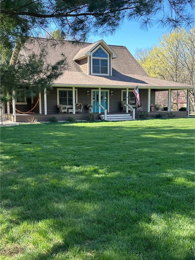 view of front of home with covered porch and a front lawn