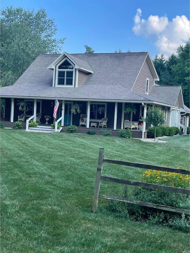 view of front of property with a front yard and covered porch